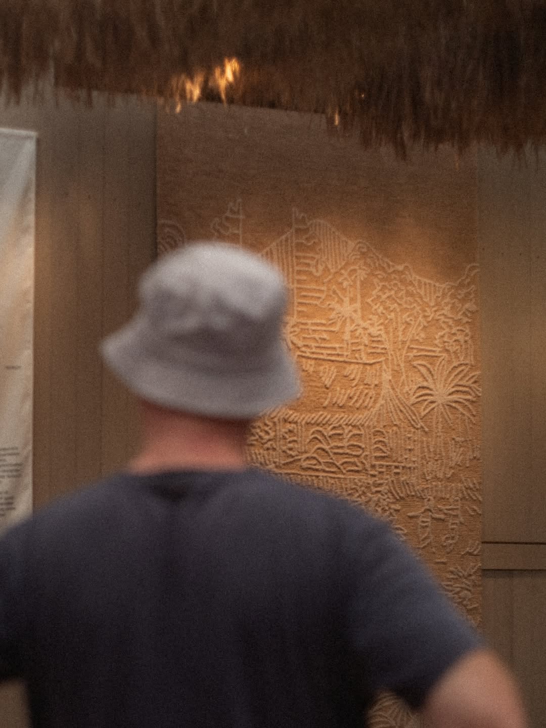 Visitor viewing Komta wall texture