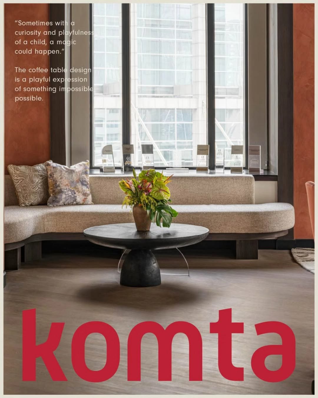 Komta living room poster with red logo